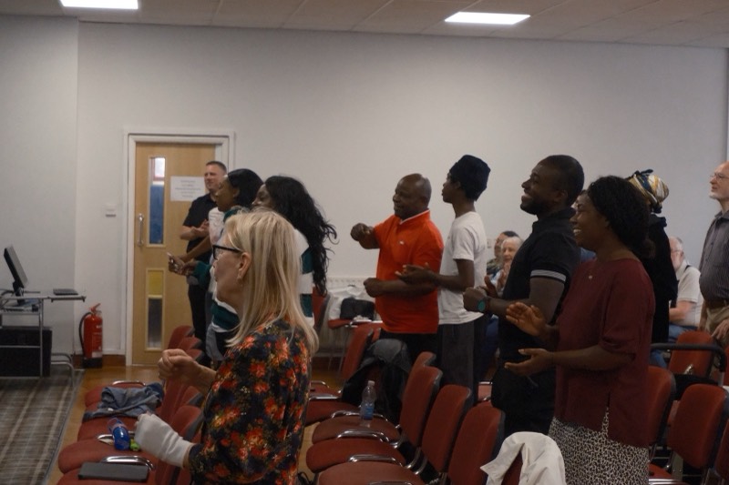 Congregation standing in worship