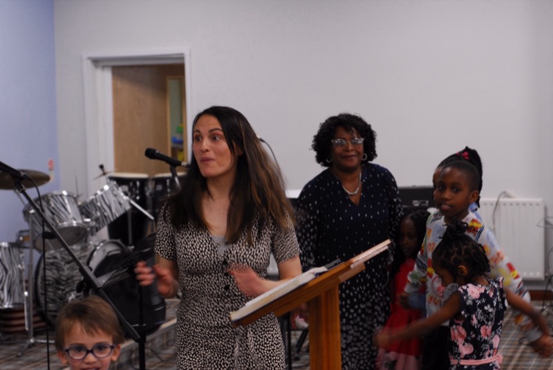 Worship leader with children